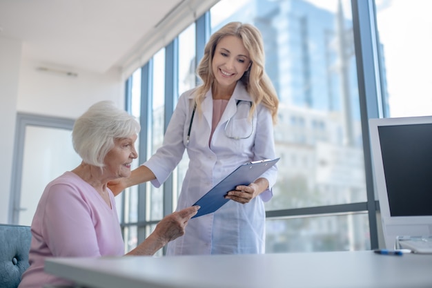 Doctor showing investigation results to the patient