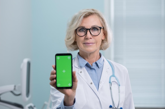 Doctor shows results of analysis holding phone in hand