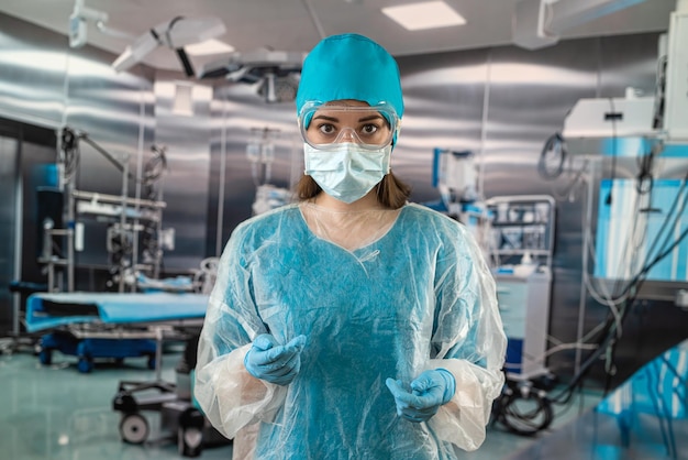 Doctor standing in an operating room in a modern clinic stands with a stethoscope waiting