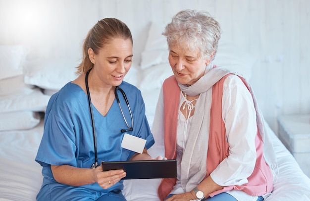 Doctor tablet and elderly patient in checkup consultation or visit at home for diagnosis or prescription Healthcare nurse holding touchscreen showing consultation exam or insurance in elderly care