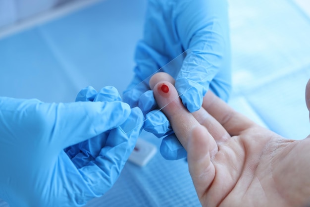 Doctor takes blood sample of patient serological test for prp blood antibodies checking blood