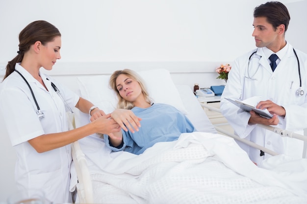 Doctor taking heartbeat of a patient