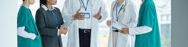 Doctor talking to his colleagues in hospital