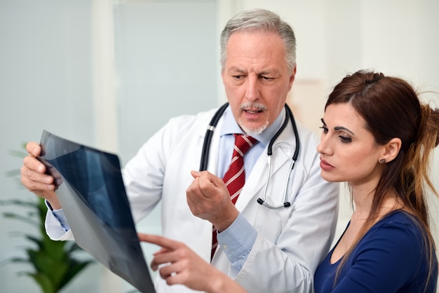 Doctor talking to a patient during a visit