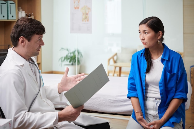 Doctor Talking to Worried Patient