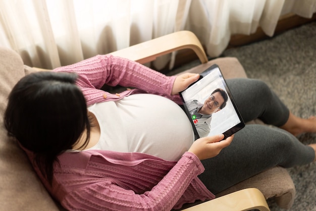 Doctor telemedicine service online video with pregnant woman for prenatal care