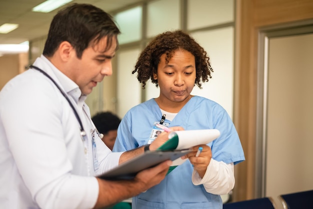 Doctor training nurse student at hospital