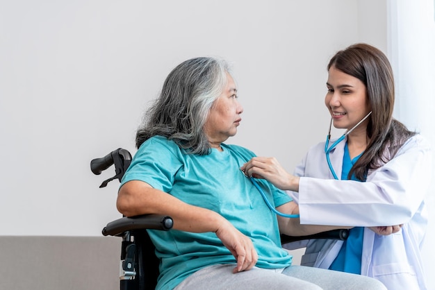 Doctor Using a stethoscope Listen  heart rate of elderly woman patients to check for heart disease