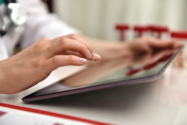 Doctor Using Tablet