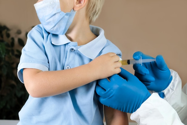 Doctor vaccinating baby boy in clinic Little child get an injection Pediatrician vaccinating 3 old years kid Vaccine for infant child Child's Immunization Children's Vaccination Health concept