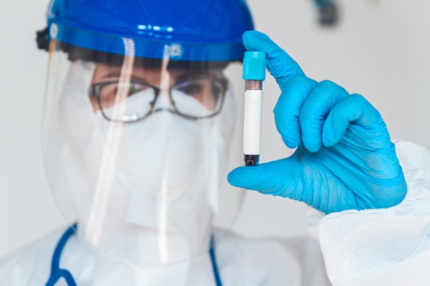 A doctor wearing a protective suit to fight coronavirus pandemic