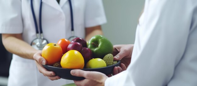 Doctor in a white coat and stethoscope on his neck is holding a fresh yellow pepper in his hands