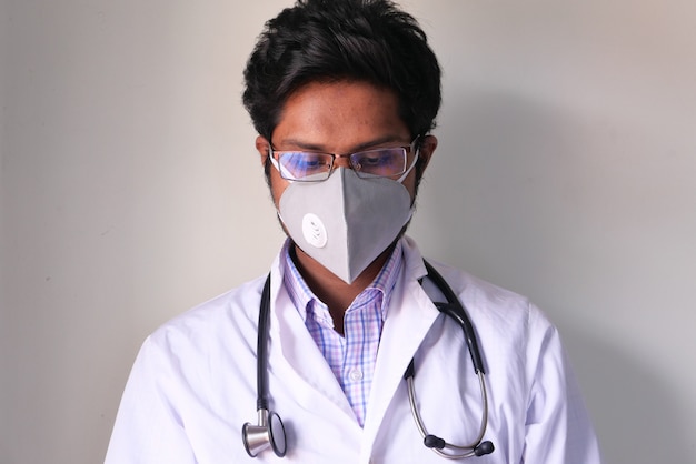 Doctor with face mask looking down