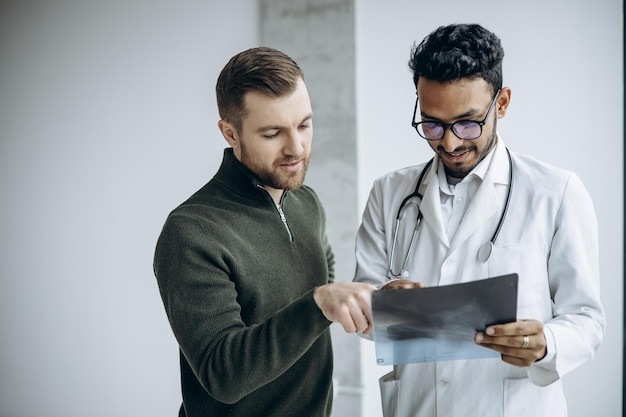 Doctor with patient looking at his xray