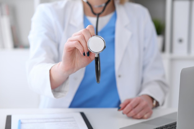 Doctor with a stethoscope in the hands.