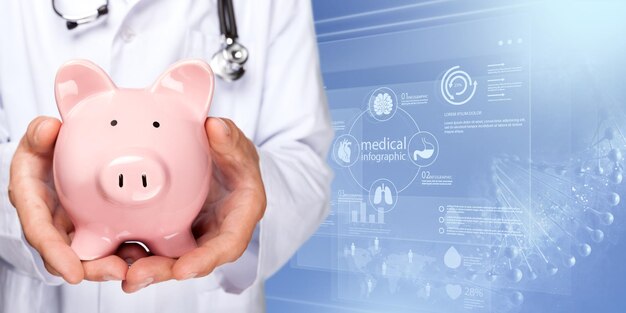 Doctor with Stethoscope Holding Piggy Bank close up