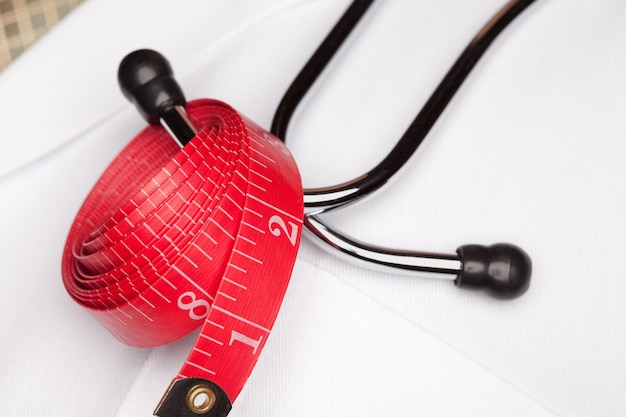 Photo doctor with stethoscope and measuring tape