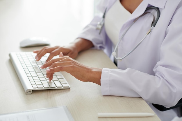 Doctor Working on Computer