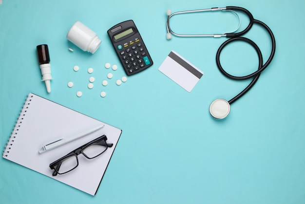 Doctoral supplies and tools, calculator on blue.