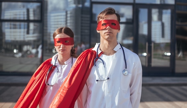 Doctors are superheroes standing on a city street