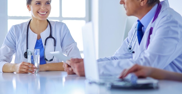 Doctors consulting with each other in a hospital conference room