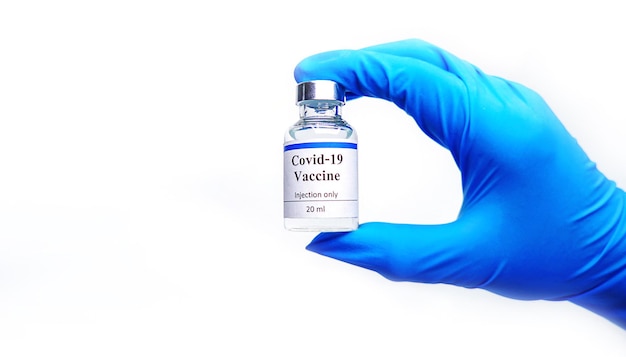 Doctors holding a bottle of covid19 nCoV Coronavirus  isolated on a white background