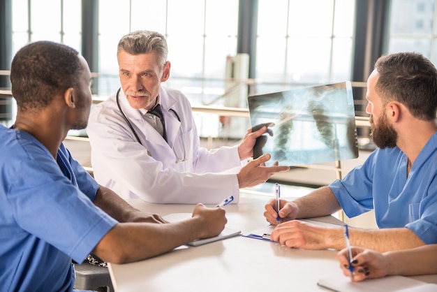 Doctors looking at an x-ray results in hospital.