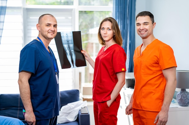 The doctors looking at an xray results in hospital Discussing medical issues