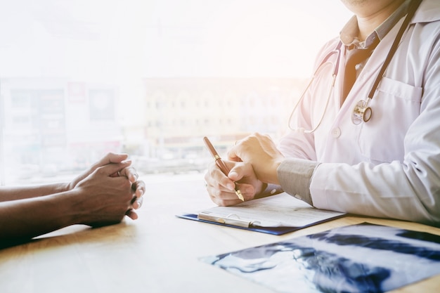 Doctors and patients sit and talk.