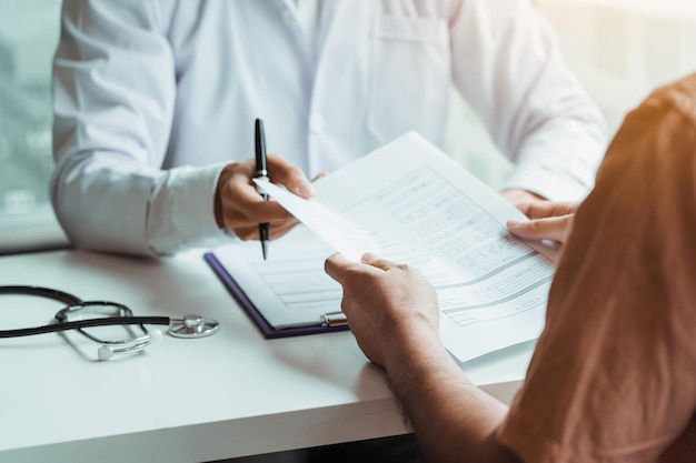 Doctors submit patient records on sticky notes and talk to patients about medications and treatment