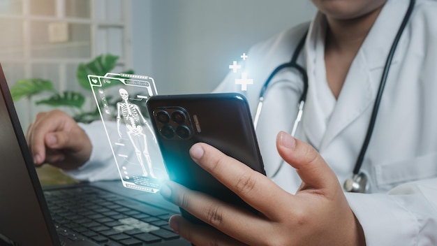 Doctors use smartphones and computers to research medical information medical concept