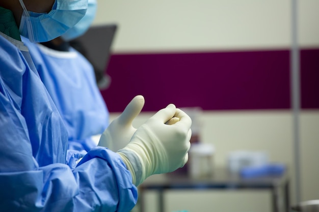 Doctors wearing surgical gloves prepare for hospital resuscitation.Medical surgical gloves latex.Equipment for safety and protection disease.