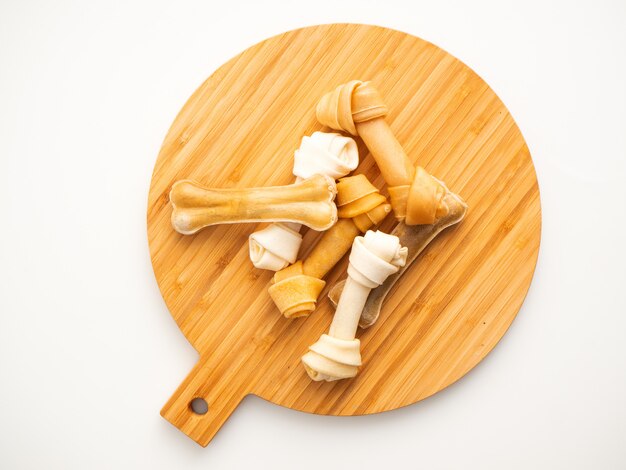 Dog food bone on Chopping Wood on white 