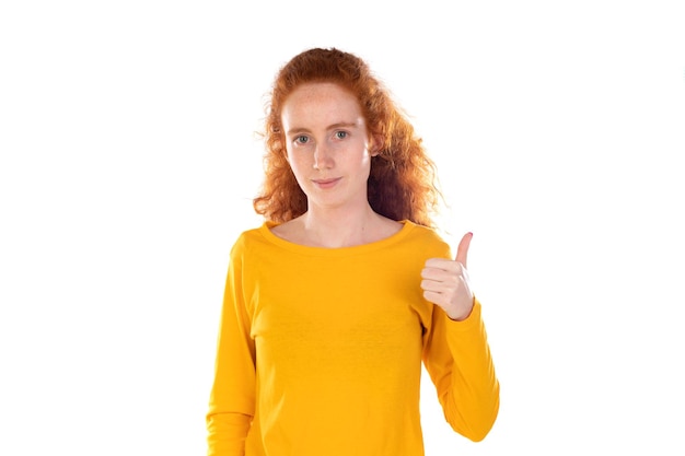 Photo doing good fascinated happy redhead curly woman show okay ok sign and smiling accepting your idea recommend product isolated on a white background