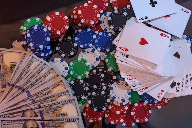 Dollar banknotes with poker chips and playing cards