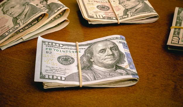 Dollar  USD US dollar bills on a wooden table