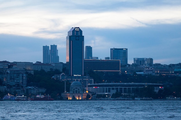 Dolmabahce Mosque and Suzer Plaza in Istanbul at dusk