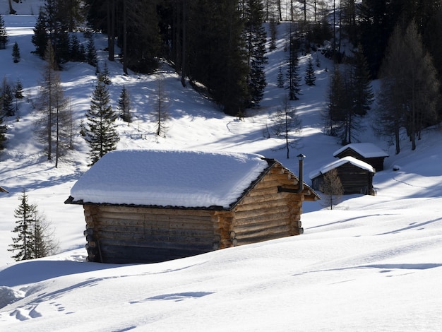 Dolomites snow panorama wooden hut val badia armentara