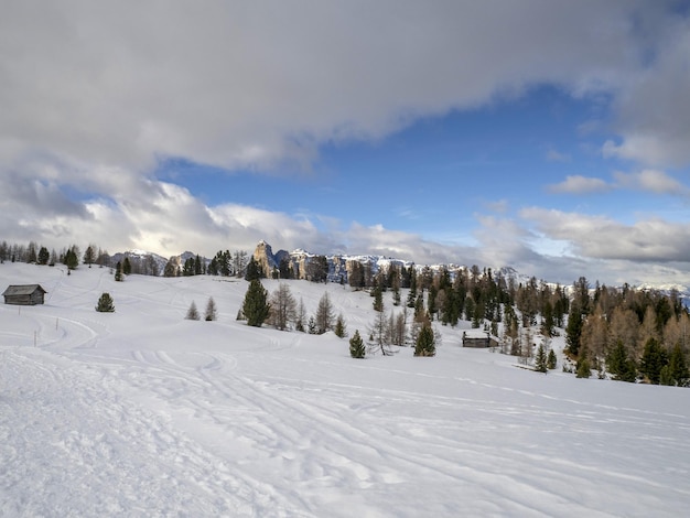 Dolomites snow panorama wooden hut val badia armentarola