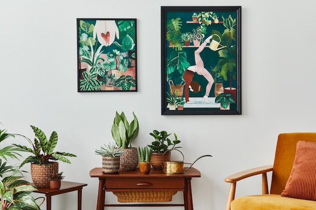 Domestic interior of living room with vintage retro shelf, a lot of house plants, cacti, wooden mock up poster frame on the white wall and elegant accessories at stylish home garden