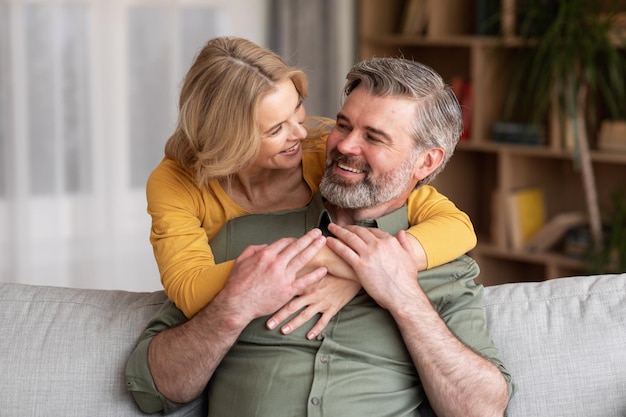 Domestic Romance Portrait Of Loving Married Middle Aged Couple Hugging At Home