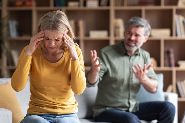 Domestic Violence Angry Middle Aged Man Screaming At His Wife At Home