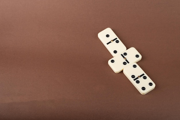 Photo dominoes on a brown background white