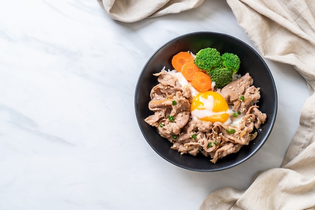 donburi, pork rice bowl with onsen egg and vegetable