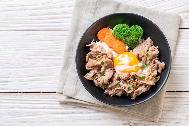 donburi, pork rice bowl with onsen egg and vegetable