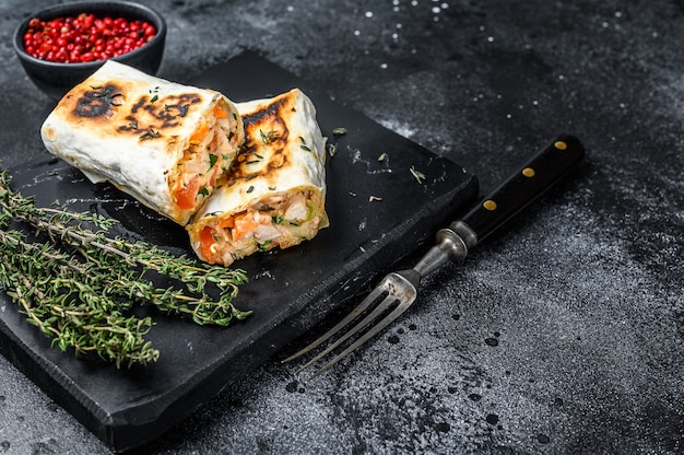 Doner kebab roll in a lavash with chicken and beef meat