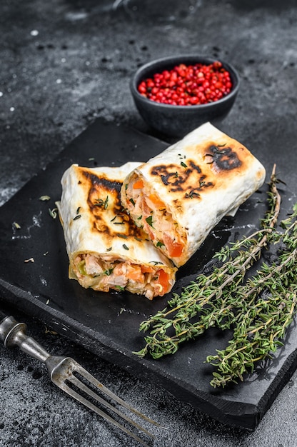 Doner kebab roll in a lavash with chicken and beef meat.