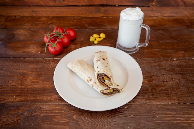 Doner kebab wrapped in lavash buttermilk tomato pepper