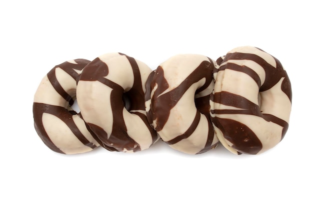 Donuts covered with chocolate and white chocolate, isolated in white background.