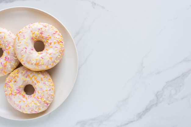 Donuts on white marble surface Photo flat lay top view